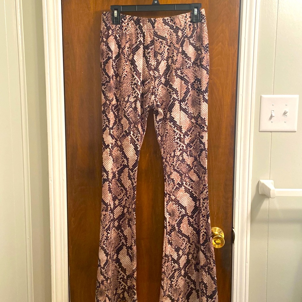 Pull on bell bottom snake print pants